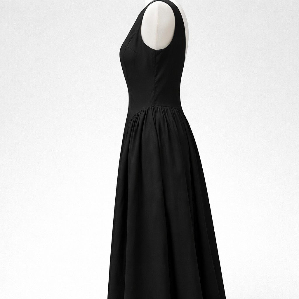 La Vie Continue black 100% cotton sleeveless long dress with a cinched waist and flowing skirt.