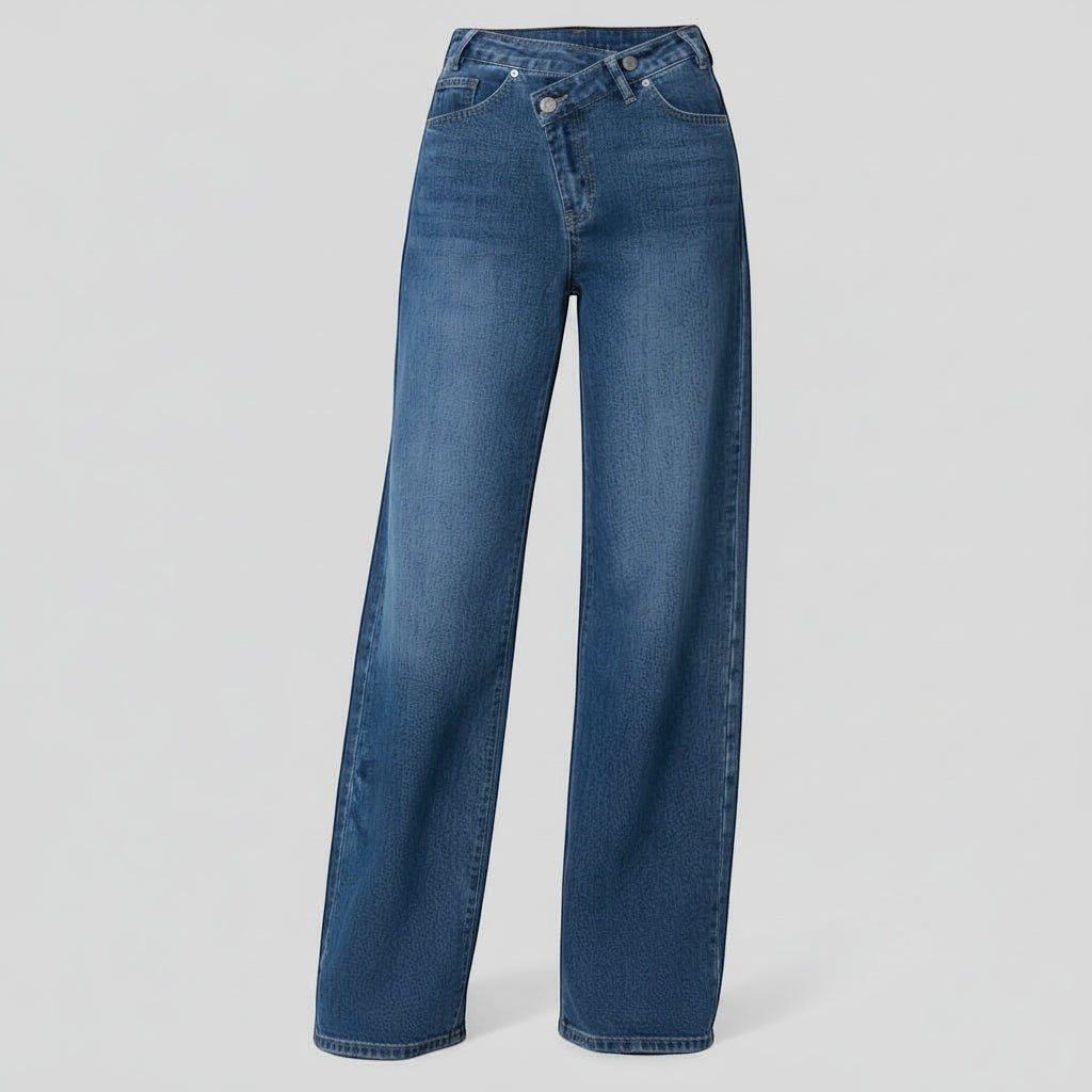 La Vie Continue blue denim wide leg jeans with asymmetric button closure and crossover waist. Made from cotton, polyester, and elastane.