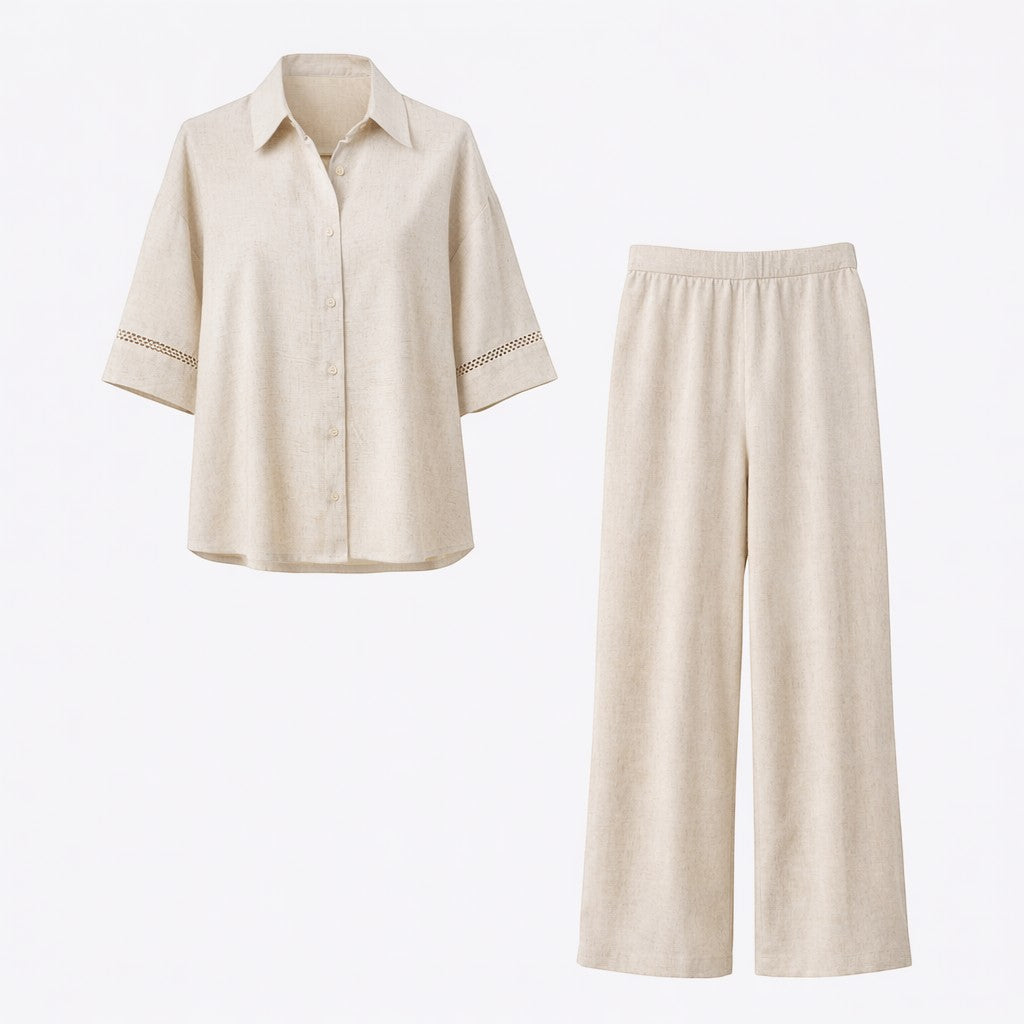 La Vie Continue ecru 100% cotton 2-piece set with short-sleeve shirt and wide-leg pants, featuring delicate eyelet details on sleeves.