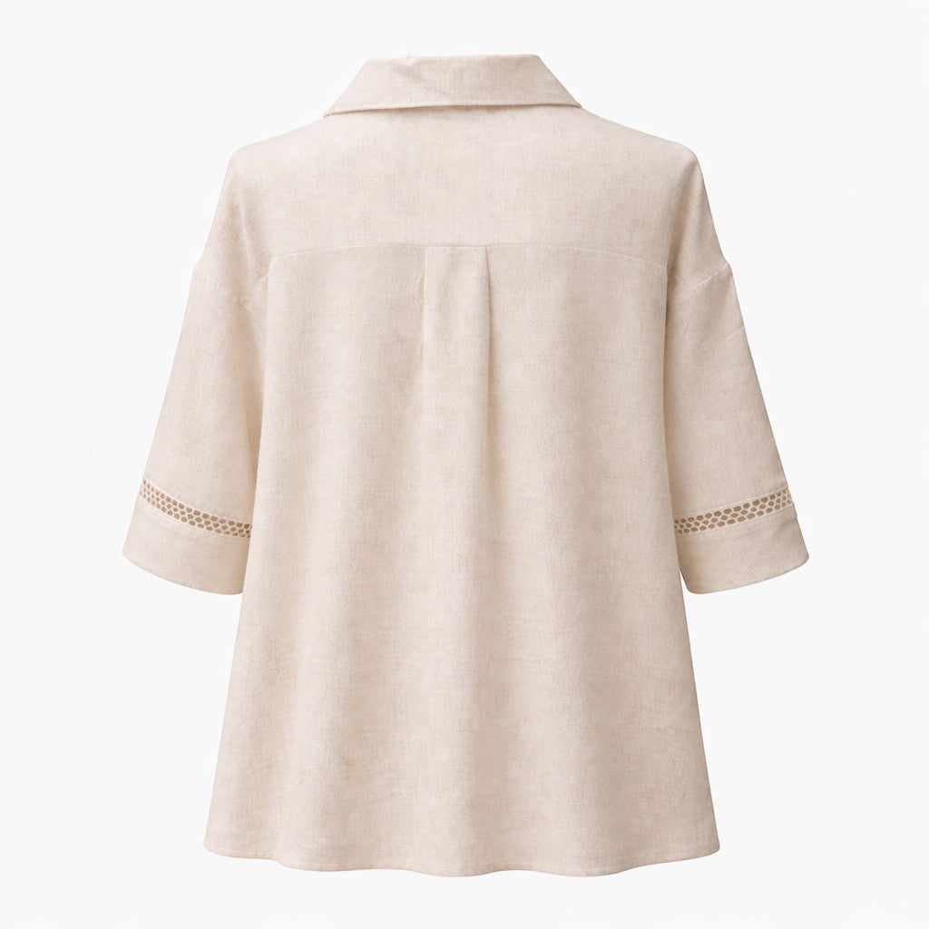La Vie Continue ecru 100% cotton shirt with crochet trim on sleeves and pleat detail on back.