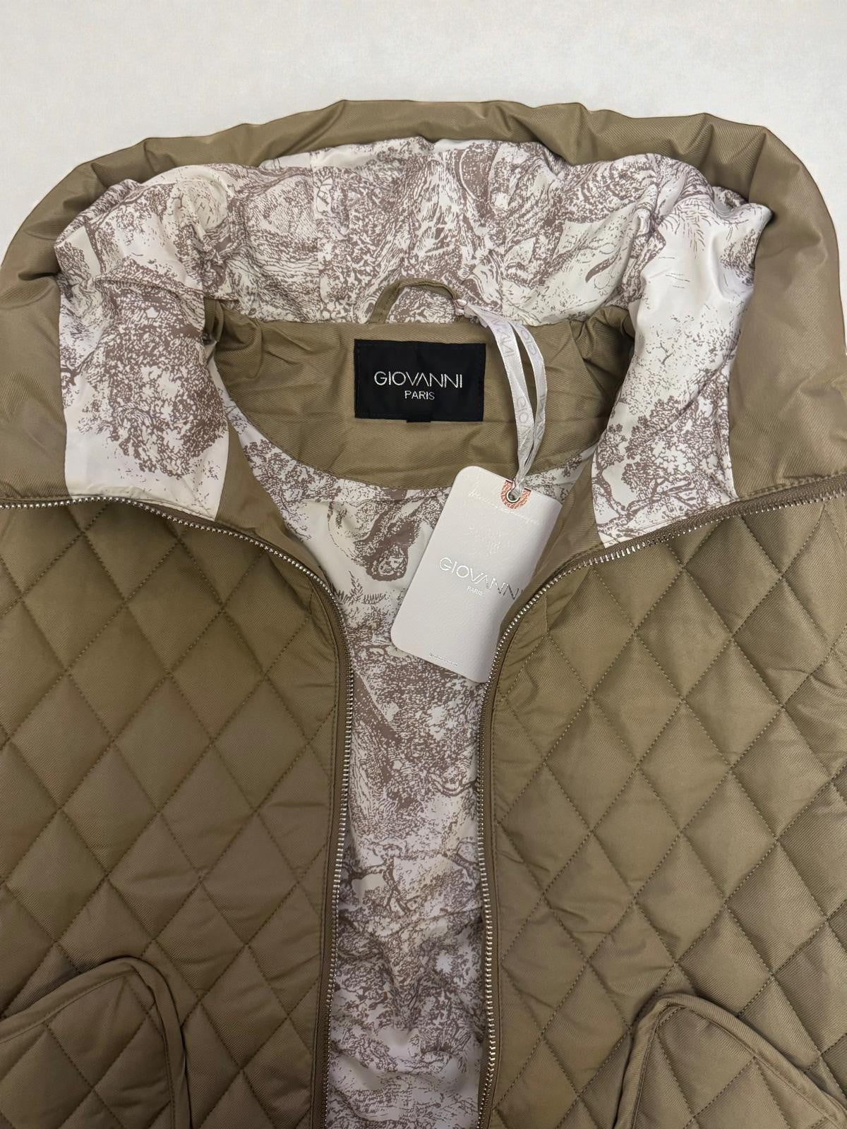 La Vie Continue Giovanni Paris khaki quilted polyester vest with a decorative patterned lining and diamond quilting.