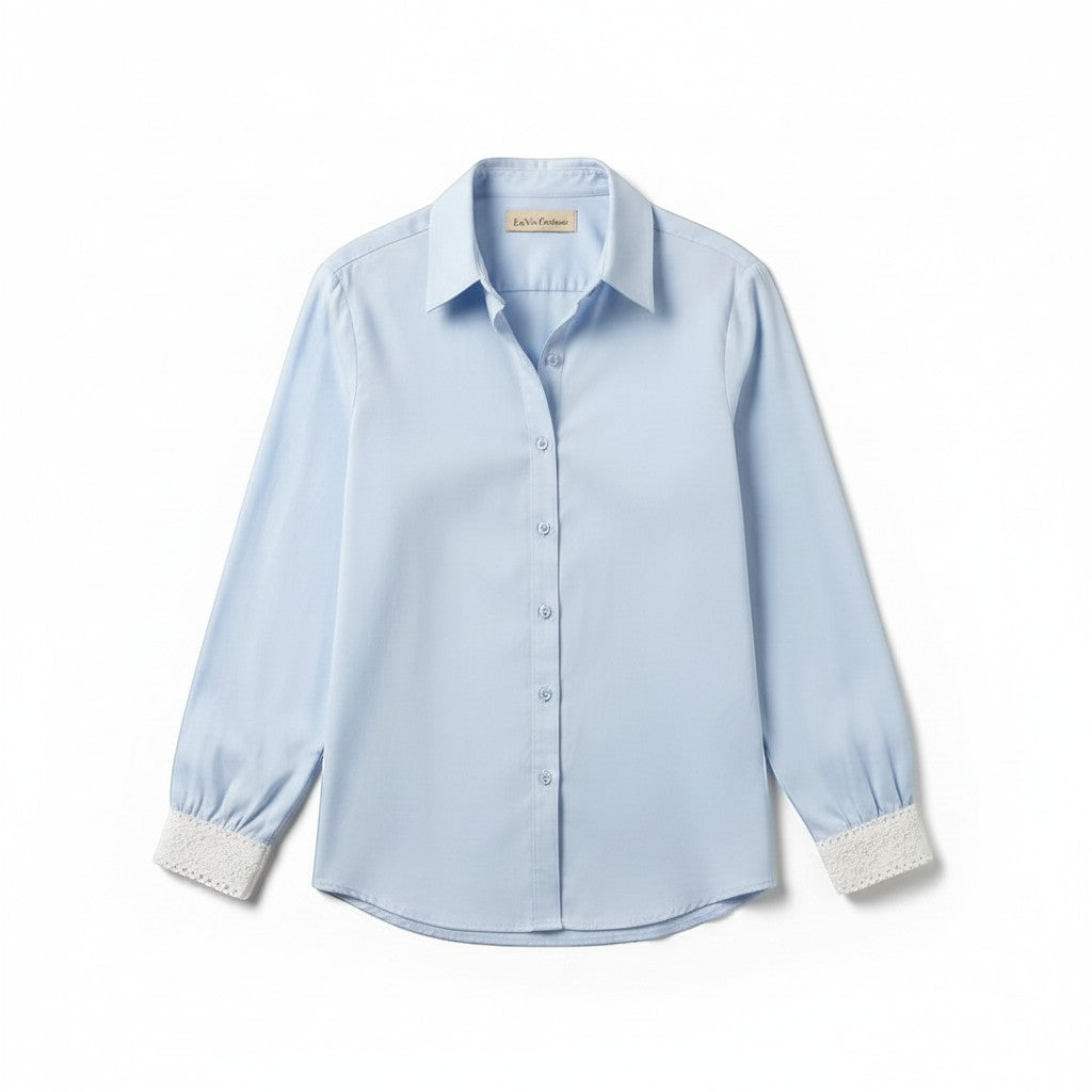 La Vie Continue light blue viscose-Tencel blend shirt with delicate lace cuffs and collar. Classic button-up style.