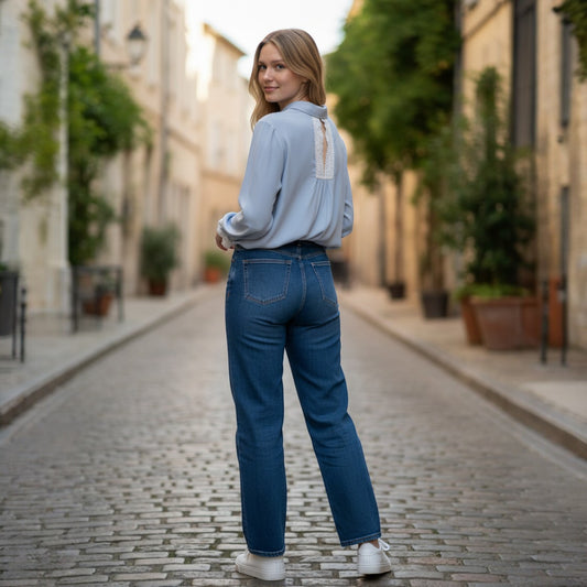 La Vie Continue light blue viscose-Tencel blend shirt with lace detail on back and sleeves, worn by a model.