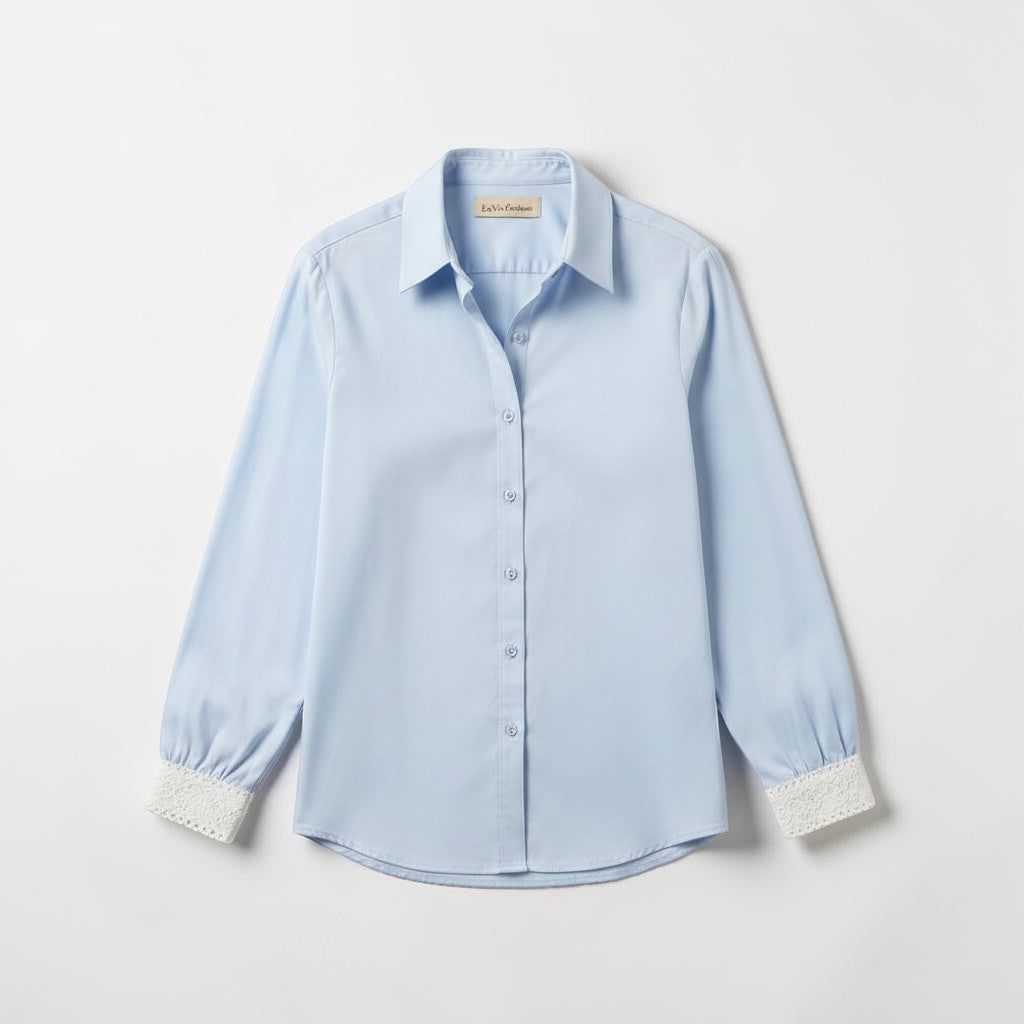 La Vie Continue light blue viscose-Tencel blend shirt with lace cuffs and collar. Classic fit, long sleeves.