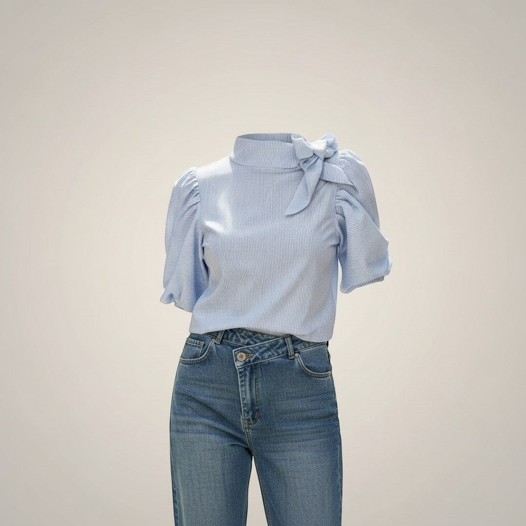 La Vie Continue light blue striped cotton-blend blouse with puffed short sleeves and a tie neck detail.