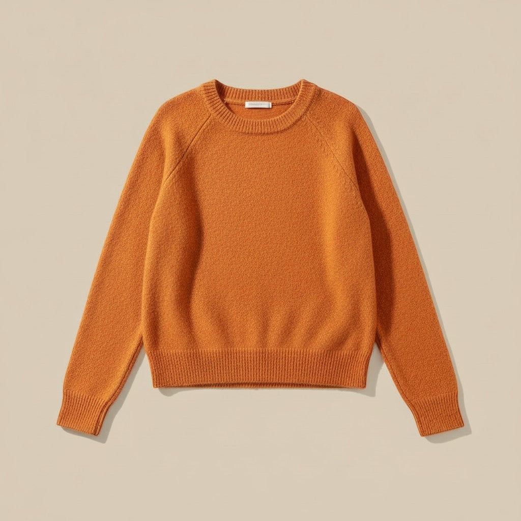 La Vie Continue orange soft knit crew neck sweater with ribbed cuffs and hem.