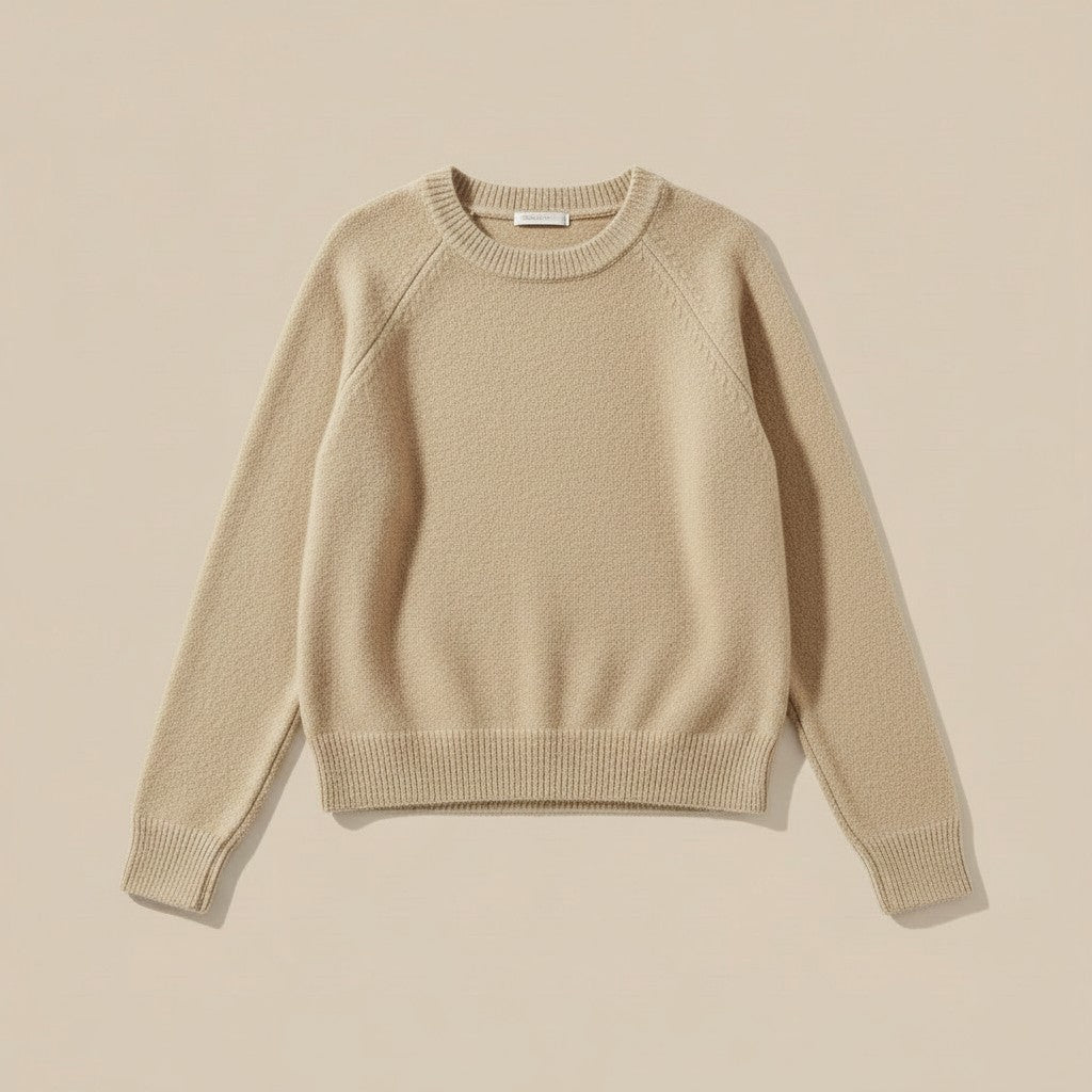 La Vie Continue orange soft knit crew neck sweater with ribbed cuffs and hem.