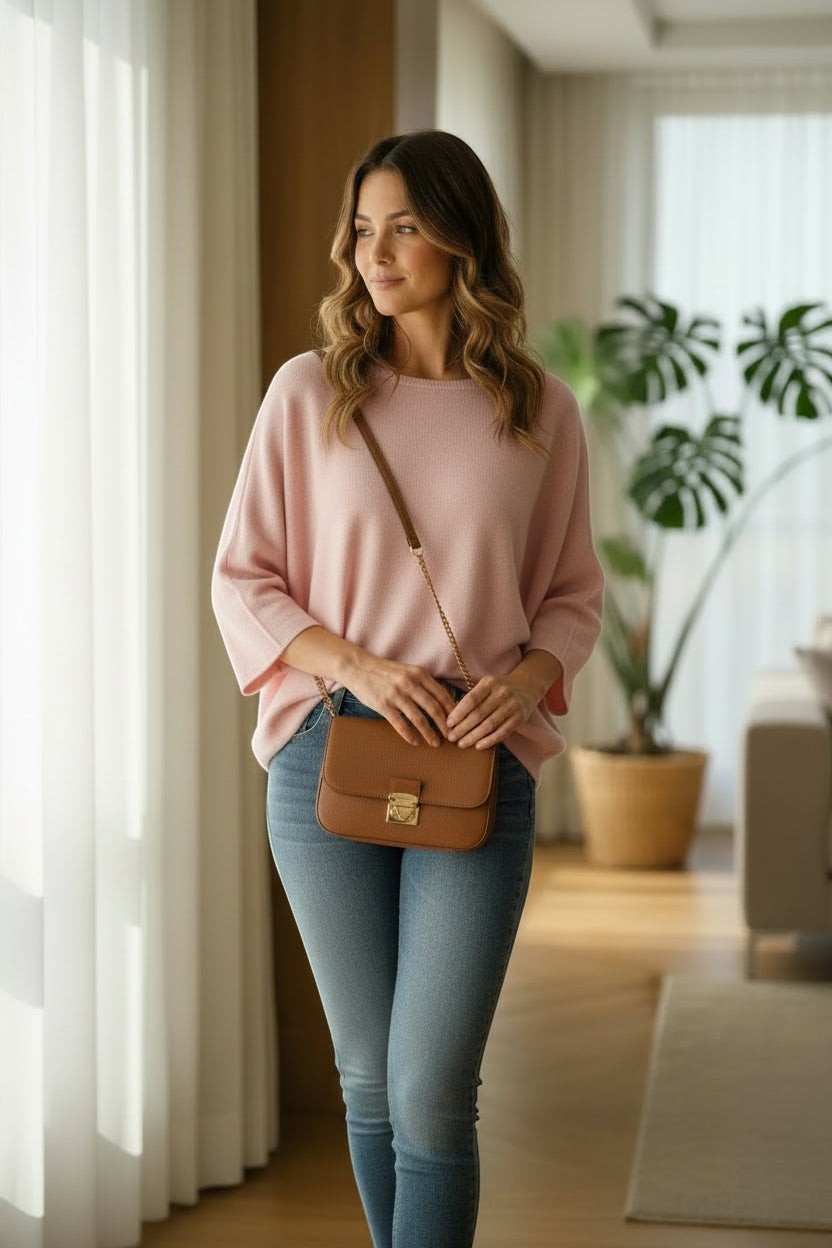 La Vie Continue light pink relaxed fit wide sleeve sweater made of viscose, polyester, and polyamide blend.