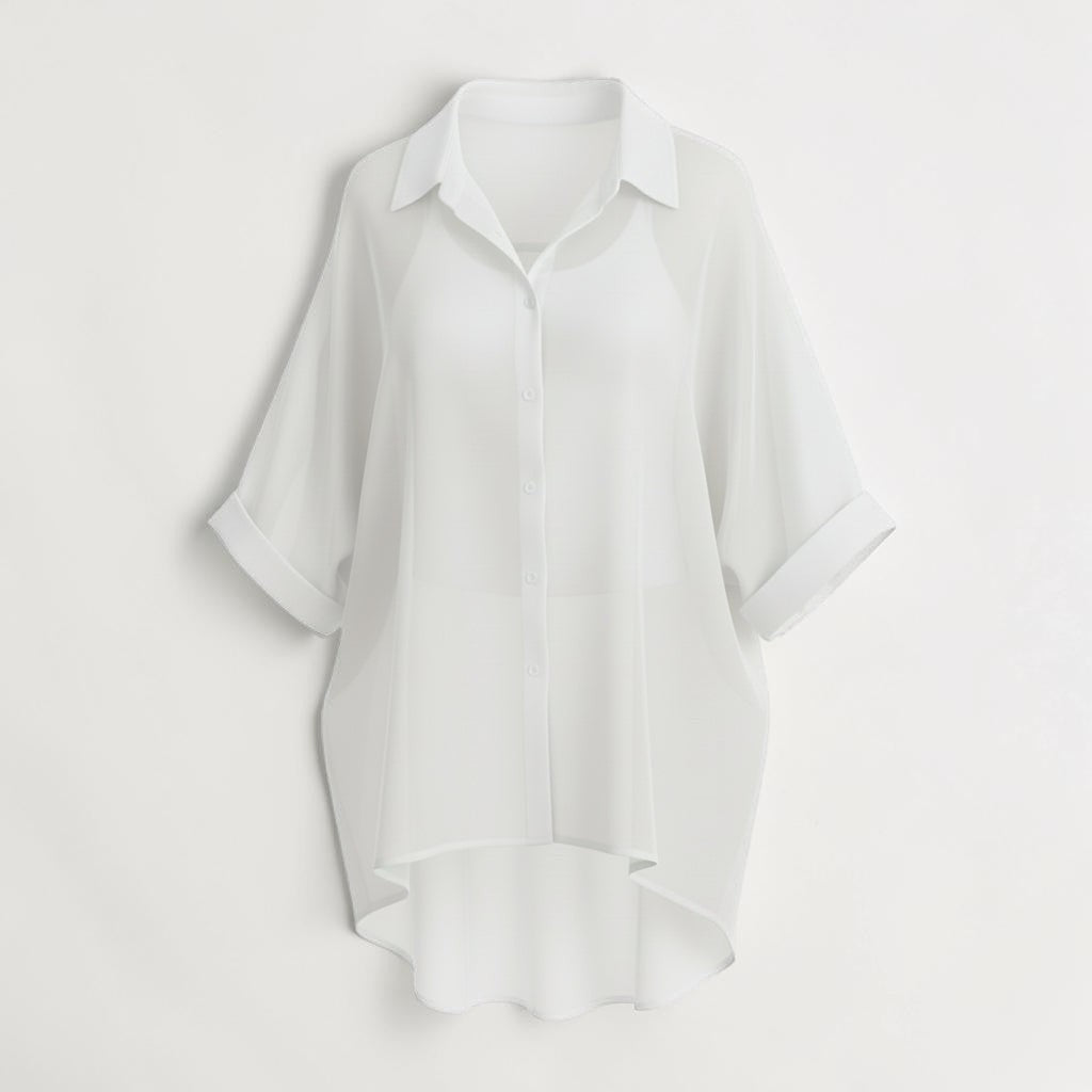 La Vie Continue white oversized fluid shirt with cuffed short sleeves, made of 85% Lyocell and 15% Polyester.